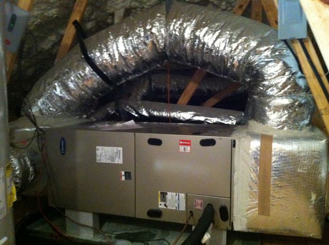 A large bypass duct sending conditioned air directly back to the return side of the air handler