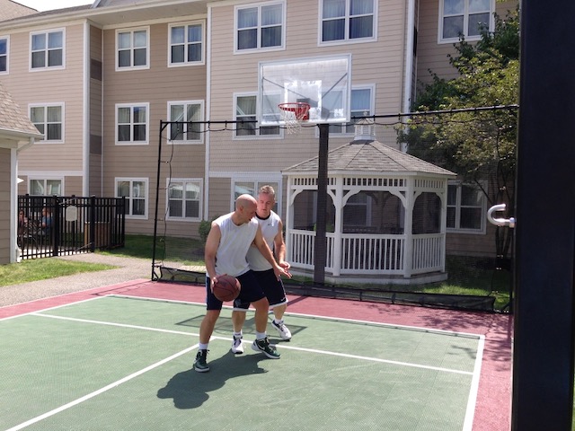 Colin and Randy playing their annual one-on-one basketball match in 2013