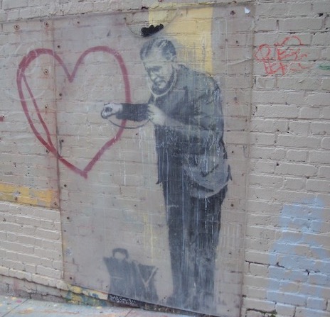 Love is more important than building science (photo of Banksy art in San Francisco, by Energy Vanguard)