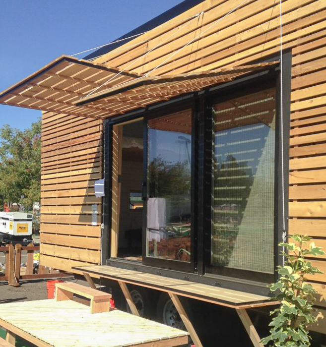 Photo showing wood shades shielding a large glass sliding door