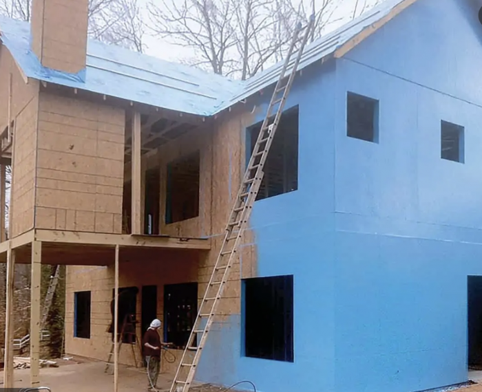  PolyWall Blue Liquid Wrap 2300 applied to a two-story home. Photo courtesy of manufacturer.