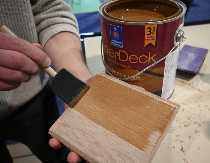 RIce husk siding being stained