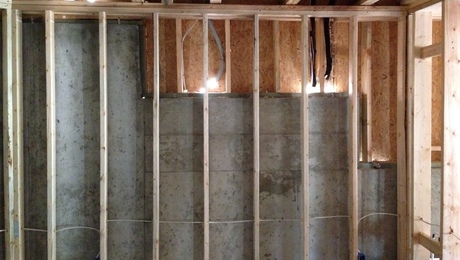 Basement exterior wall with interior framed wall